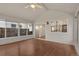 Well-lit sunroom featuring large windows and sliding glass doors offering serene outdoor views at 10450 W 81St Pl, Arvada, CO 80005