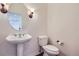 Bathroom featuring a pedestal sink and classic fixtures at 6885 Saddleback Ave, Firestone, CO 80504