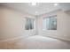 Unfurnished basement bedroom with dual egress windows allowing natural light at 2264 S Joyce St, Lakewood, CO 80228