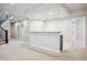 Finished basement with a bar area, carpet flooring, and plenty of space for entertaining at 2264 S Joyce St, Lakewood, CO 80228