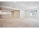 Finished basement featuring neutral carpet, recessed lighting, and a convenient bar area at 2264 S Joyce St, Lakewood, CO 80228
