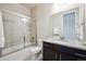 Elegant bathroom with granite countertops, a glass-enclosed shower, and modern fixtures at 2264 S Joyce St, Lakewood, CO 80228