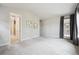 Comfortable bedroom with ensuite bathroom, artwork, and natural light at 2264 S Joyce St, Lakewood, CO 80228