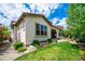 Well-maintained home with lush green lawn and mature landscaping at 2264 S Joyce St, Lakewood, CO 80228