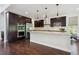 Modern kitchen with stainless steel appliances and granite countertops at 2264 S Joyce St, Lakewood, CO 80228