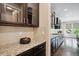 Modern kitchen with granite countertops, sleek cabinetry, and stainless steel appliances at 2264 S Joyce St, Lakewood, CO 80228