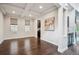 Open-concept living room featuring coffered ceilings, hardwood floors, and ample natural light at 2264 S Joyce St, Lakewood, CO 80228
