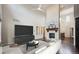 Spacious living room features a stone fireplace, high ceilings, and hardwood floors at 2264 S Joyce St, Lakewood, CO 80228