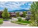 Picturesque neighborhood view with well-maintained homes, mature trees, and mountain backdrop at 2264 S Joyce St, Lakewood, CO 80228