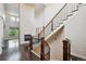 Elegant staircase featuring wood banisters and iron spindles at 2264 S Joyce St, Lakewood, CO 80228