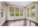 Inviting sun room with hardwood floors and abundant natural light at 2264 S Joyce St, Lakewood, CO 80228