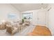 Bright living room with hardwood floors, a large window, neutral furniture and decor at 9917 Garland Dr, Broomfield, CO 80021