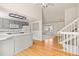 Bright, open layout connecting the kitchen, staircase, and living area, perfect for modern living at 9917 Garland Dr, Broomfield, CO 80021