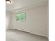 Bright, carpeted bedroom with large window, baseboard heater, and neutral walls is move-in ready at 30221 Stagecoach Blvd, Evergreen, CO 80439