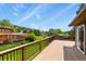 Spacious deck featuring wood railings with a beautiful view of the surrounding landscape at 30221 Stagecoach Blvd, Evergreen, CO 80439