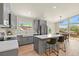 Stylish kitchen with island seating and backyard access at 30221 Stagecoach Blvd, Evergreen, CO 80439