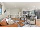 Inviting living room boasts wood floors and stylish, neutral decor at 30221 Stagecoach Blvd, Evergreen, CO 80439