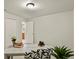 Well-lit office featuring gray carpet, a desk with charming decor, and a peek into the bathroom at 30221 Stagecoach Blvd, Evergreen, CO 80439