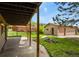 Spacious covered patio connecting to a detached garage; perfect for outdoor living at 30221 Stagecoach Blvd, Evergreen, CO 80439