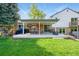 Expansive backyard with a large covered patio perfect for outdoor dining and entertaining at 6979 E Fremont Ave, Centennial, CO 80112