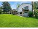 Beautiful backyard featuring a patio, hot tub, mature trees, and lush landscaping at 6979 E Fremont Ave, Centennial, CO 80112