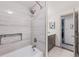 Modern bathroom featuring tiled shower, sleek fixtures, and white marble at 6979 E Fremont Ave, Centennial, CO 80112