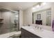 Well-lit bathroom with glass shower and updated vanity at 6979 E Fremont Ave, Centennial, CO 80112