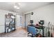 Bedroom with hardwood floors, a bookshelf, and desk space at 6979 E Fremont Ave, Centennial, CO 80112
