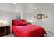 Cozy bedroom featuring a large bed, ambient lighting, and neutral wall decor at 6979 E Fremont Ave, Centennial, CO 80112
