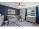 Charming Bedroom with a blue accent wall and plenty of natural light at 6979 E Fremont Ave, Centennial, CO 80112