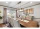 Elegant dining room with a large table, stylish lighting, and sophisticated decor at 6979 E Fremont Ave, Centennial, CO 80112