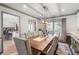 Elegant dining room with a large table, stylish lighting, and sophisticated decor at 6979 E Fremont Ave, Centennial, CO 80112