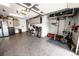 A well-organized garage with a weight-lifting station, storage cabinets, and durable epoxy flooring for a functional space at 6979 E Fremont Ave, Centennial, CO 80112