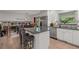 Modern kitchen with stainless steel appliances, granite countertops, and a breakfast bar at 6979 E Fremont Ave, Centennial, CO 80112