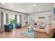 Comfortable living room with hardwood floors, large windows, and stylish decor at 6979 E Fremont Ave, Centennial, CO 80112