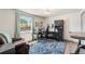 Office space featuring a desk, blue rug, and a chair at 6979 E Fremont Ave, Centennial, CO 80112