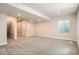 Finished basement offers a large living space with a window and neutral colors; perfect for recreation at 2387 Bristol St, Superior, CO 80027