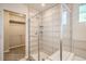 Modern bathroom with a glass enclosed shower and adjacent walk-in closet space at 2387 Bristol St, Superior, CO 80027