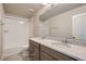 Well-lit bathroom with a dual-sink vanity and tub-shower combination at 2387 Bristol St, Superior, CO 80027