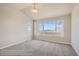 Spacious bedroom filled with natural light from large windows, complemented by neutral tones and plush carpeting at 2387 Bristol St, Superior, CO 80027