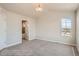 Inviting bedroom with a vaulted ceiling, natural light, and plush carpeting at 2387 Bristol St, Superior, CO 80027