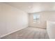 Bright and airy bedroom with carpeted floors and a scenic window view at 2387 Bristol St, Superior, CO 80027