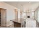 Open layout reveals a kitchen island with granite counters flowing seamlessly into a bright, comfortable living space at 2387 Bristol St, Superior, CO 80027