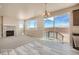 Spacious living room with a fireplace, patio access, and an open view to the kitchen at 2387 Bristol St, Superior, CO 80027