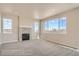 Bright living room with a cozy fireplace and large windows offering plenty of natural light at 2387 Bristol St, Superior, CO 80027