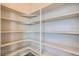 Walk-in pantry provides ample shelving for organized storage of food items and kitchen essentials at 2387 Bristol St, Superior, CO 80027