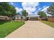 Charming home with a well-maintained front lawn and a long driveway leading to a two-car garage at 1018 Kelly Pl, Longmont, CO 80501
