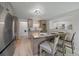Modern kitchen with stainless steel appliances, a center island with seating, and updated lighting at 1018 Kelly Pl, Longmont, CO 80501