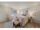 Serene main bedroom with natural light, neutral decor, and comfortable seating at 1018 Kelly Pl, Longmont, CO 80501