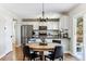 Charming dining area connected to a modern kitchen, perfect for Gathering meals at 4241 Brookwood Pl, Highlands Ranch, CO 80130